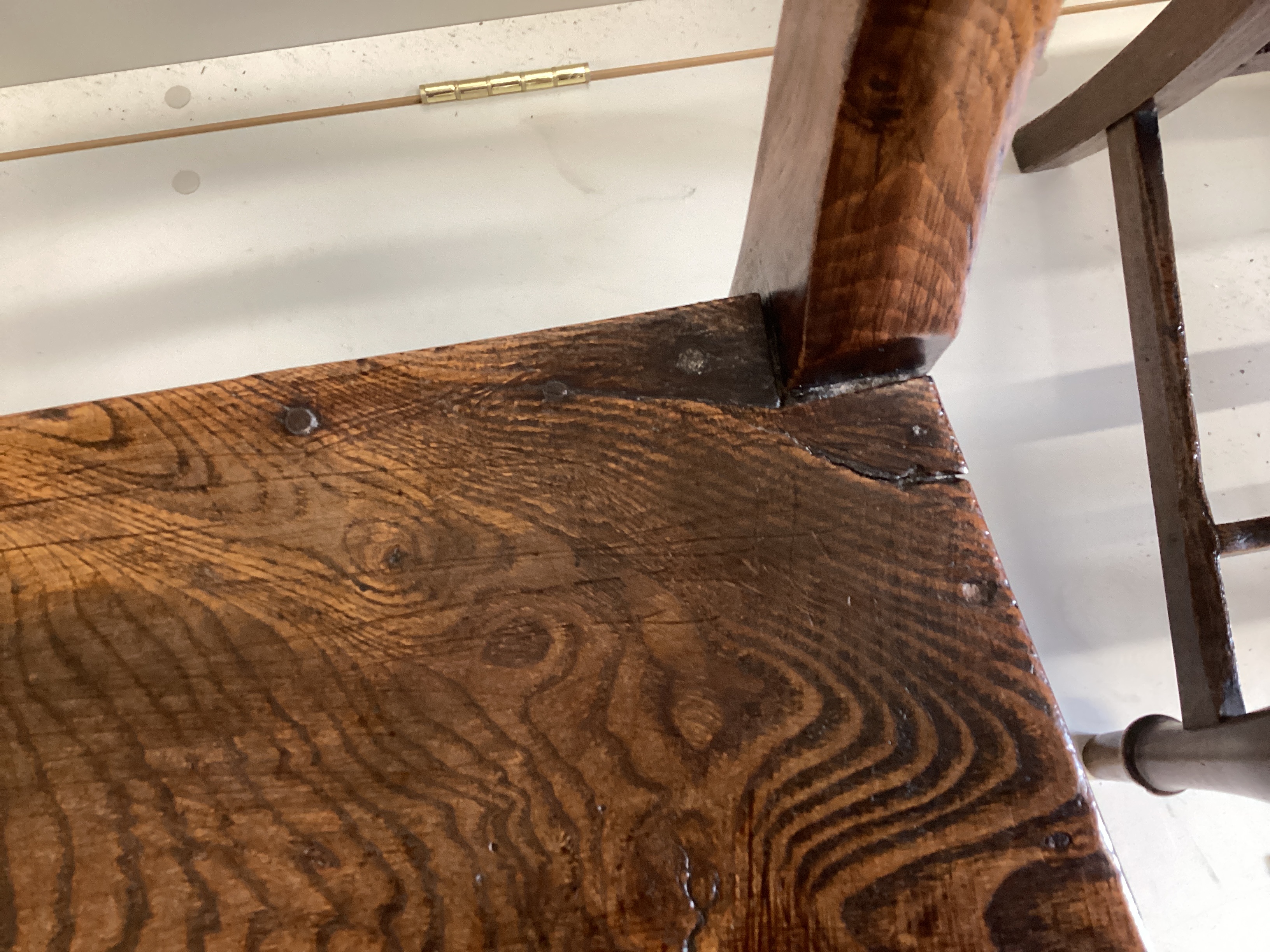 A pair of Regency provincial elm wood seat dining chairs, width 44cm, depth 36cm, height 86cm